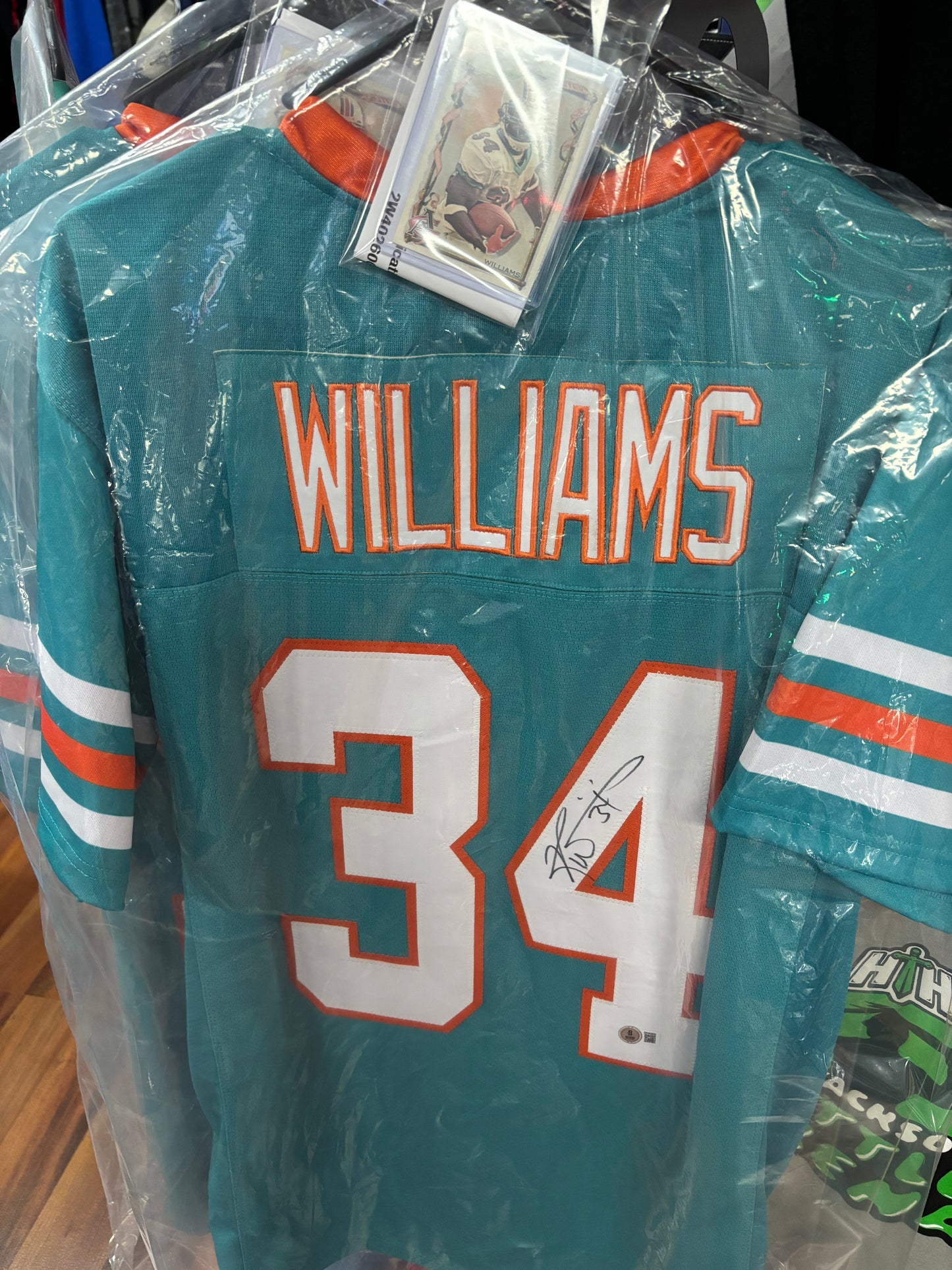 Ricky Williams Autographed Miami Dolphins XL Jersey with Beckett COA and mint card.